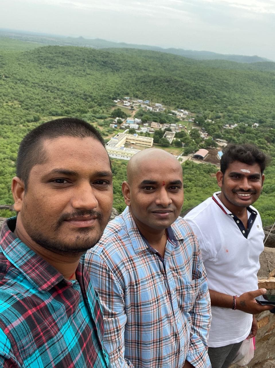 Travellers at the Sri Malyadri Lakshmi Narasimha Swamy Temple hilltop overlooking the valley, Malakonda, Andhra Pradesh
